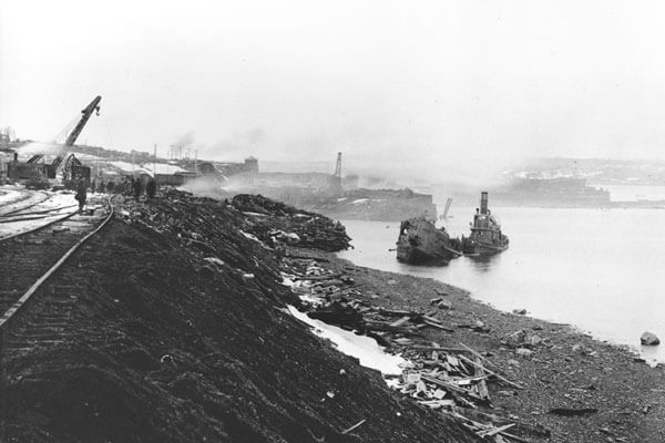 1917 Halifax Explosion image of destroyed ships and land.
