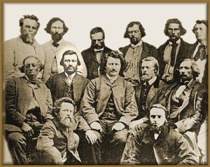 John Bruce (Jean Brousse) sits to the right of Louis Riel