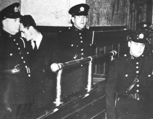Image of Joseph Guay with police officers