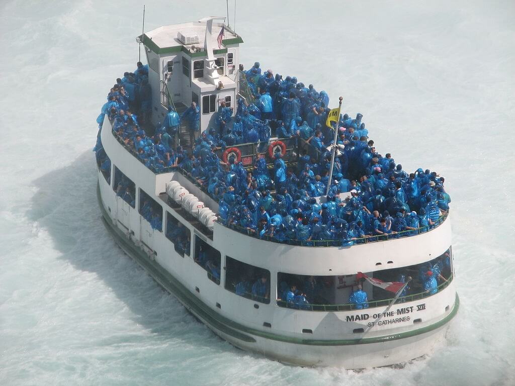 Blue poncho-clad tourists on the Maid of the Mist.